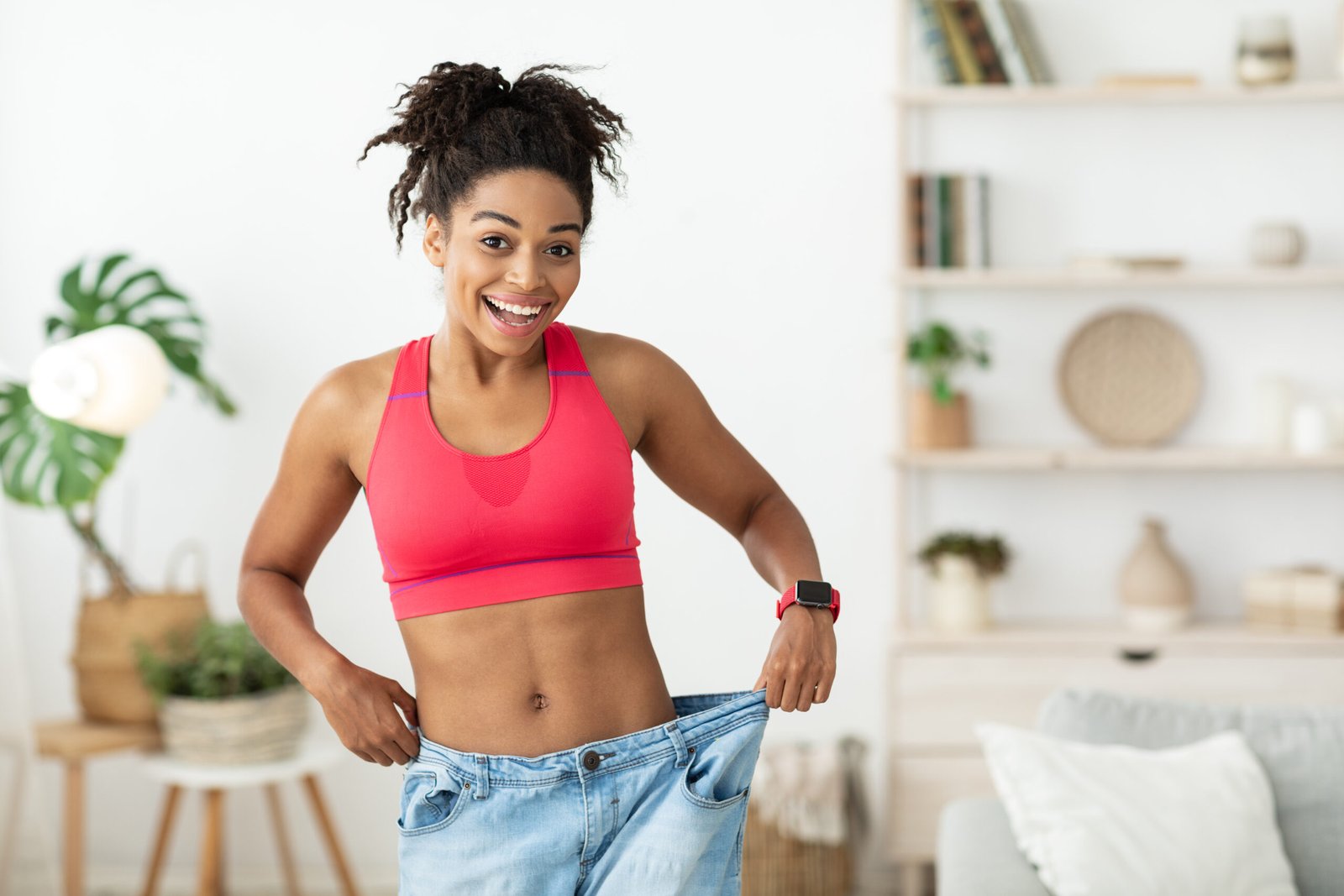 Woman celebrating her weight-loss progress